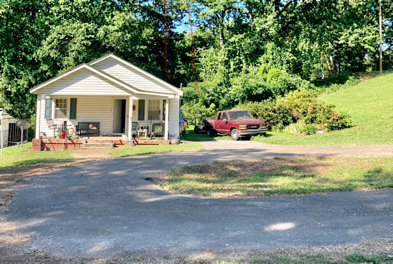 The same house and driveway clear after the fallen tree was removed